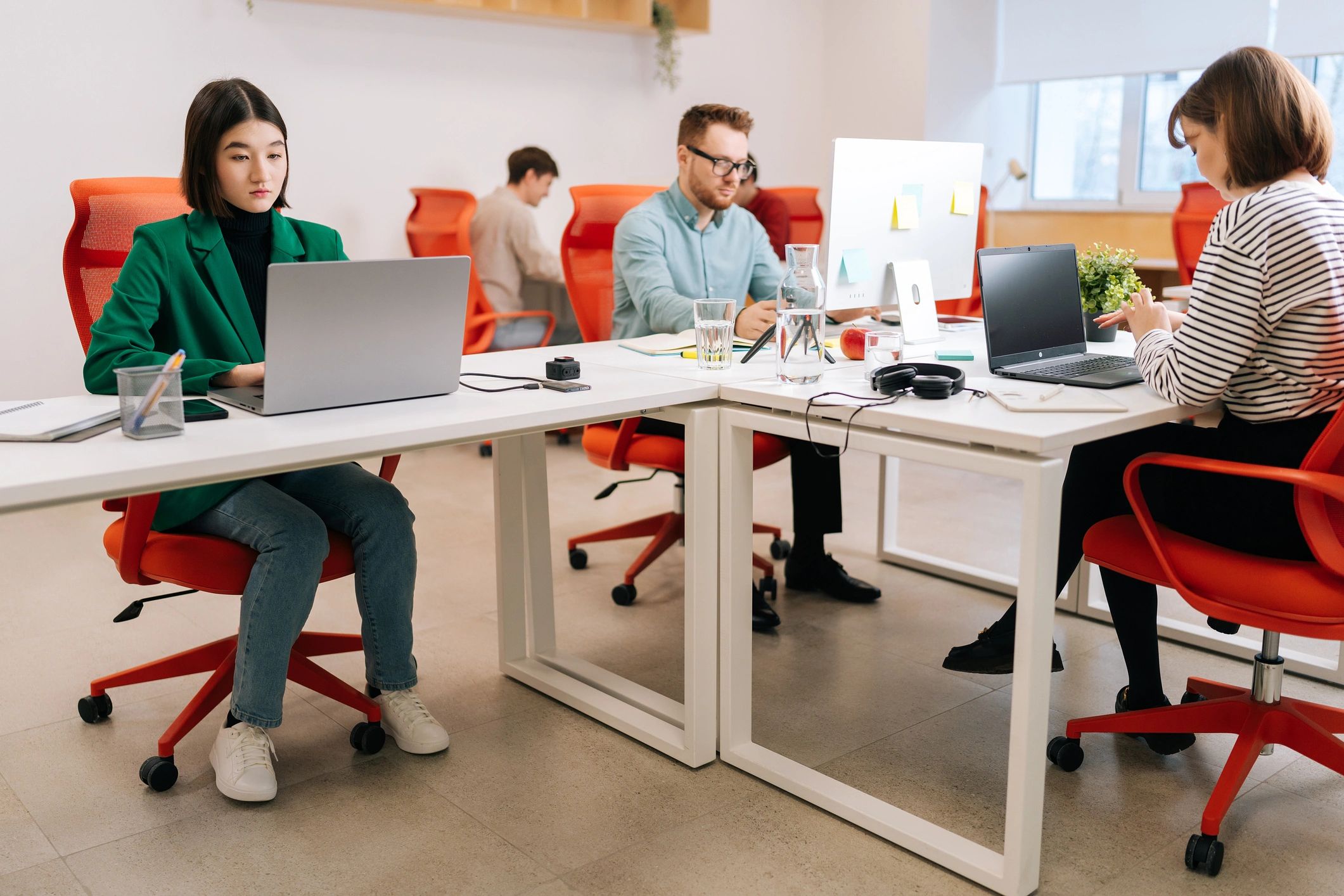 Solutions specialists collaborating at a shared workspace