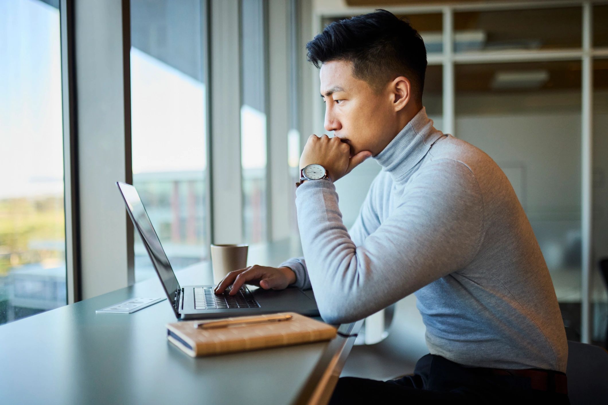 Professional working on laptop for business technology support